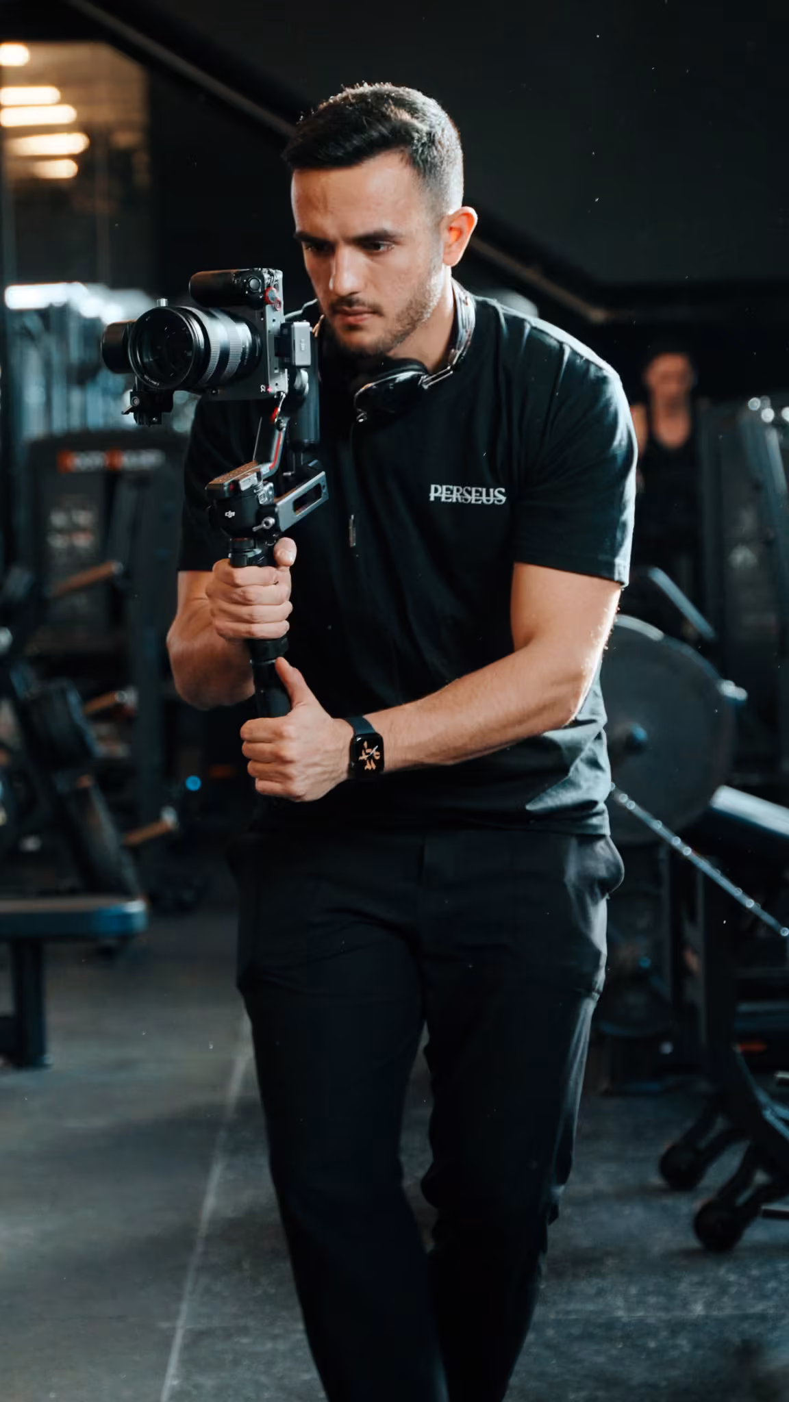 Perseus Creative Studio videographer operating a gimbal-stabilized cinema camera while filming branded video content on location in Vancouver.